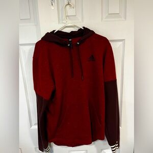 Size M Adidas Hoodie. Varying shades of red with striped cuffed wrists